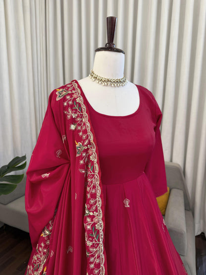 Red embroidered Anarkali suit with floral dupatta, perfect for weddings and festivals