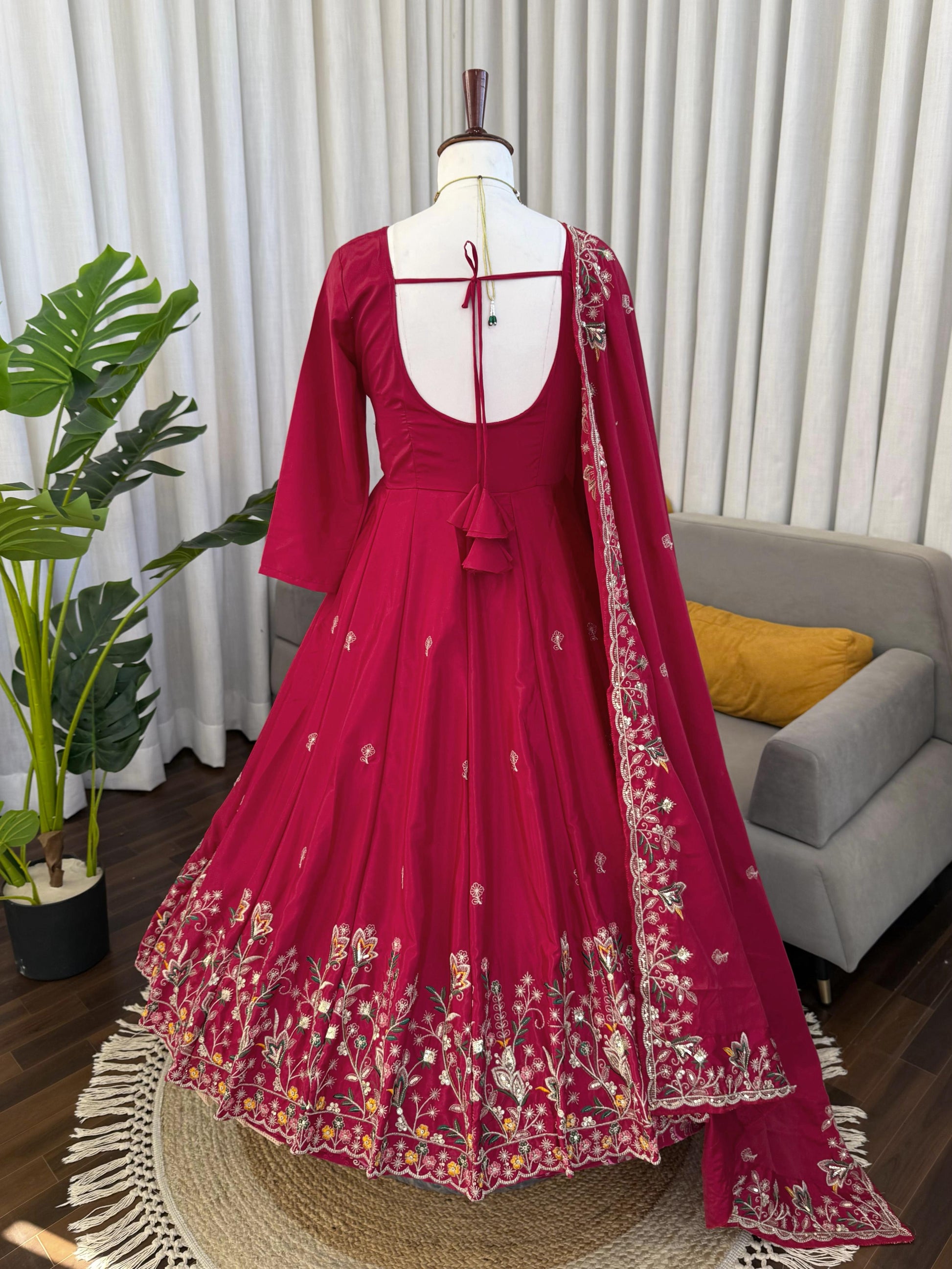 Red embroidered Anarkali suit with floral detailing, perfect for weddings and festivals