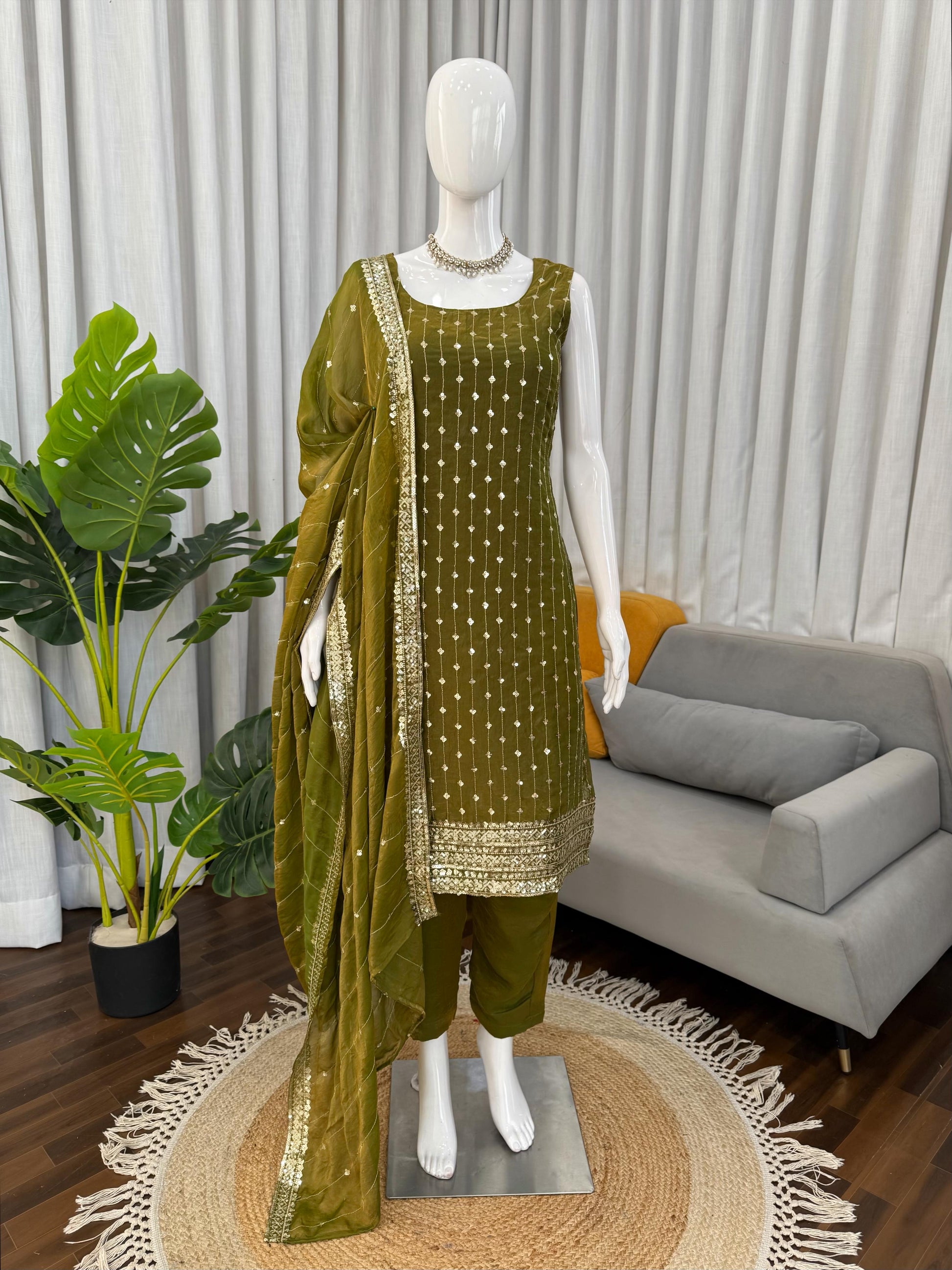 Olive green embroidered palazzo suit with sequin dupatta, perfect for festivals and weddings.