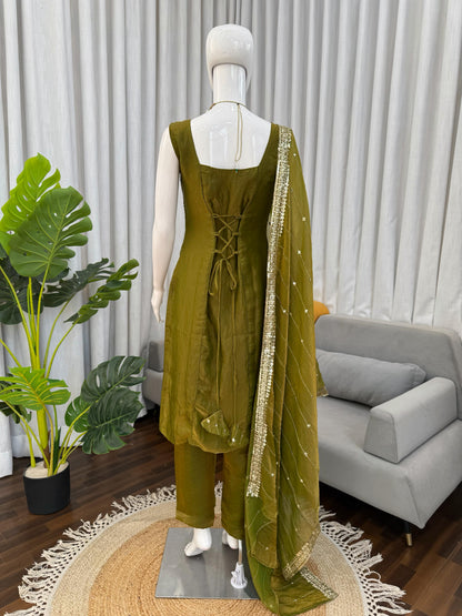 Olive green ethnic palazzo suit with lace-up back and sequin dupatta, perfect for festivals and weddings.
