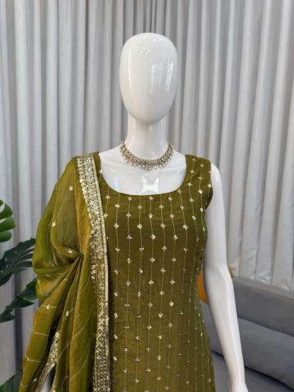 Olive green Anarkali suit with gold sequin embroidery, paired with matching dupatta and statement necklace for festive occasions.